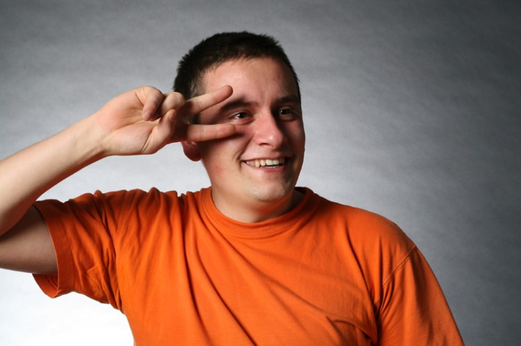 Calin Ilea playfully swipes his hand across his face to the tune of imaginary music. Ilea, a graduate student from Romania, enjoys playing soccer in his free time. [Friday, Feb. 13]