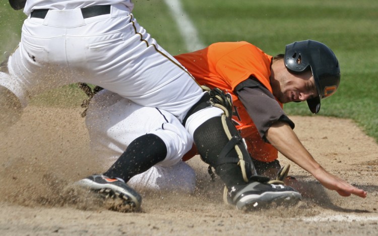 Oklahoma State junior shortstop Jordy Mercer slides home during the series finale against the Tigers on April 6, 2007, in Taylor Stadium. Mercer scored three runs in the game, which the Sooners won 8-6.