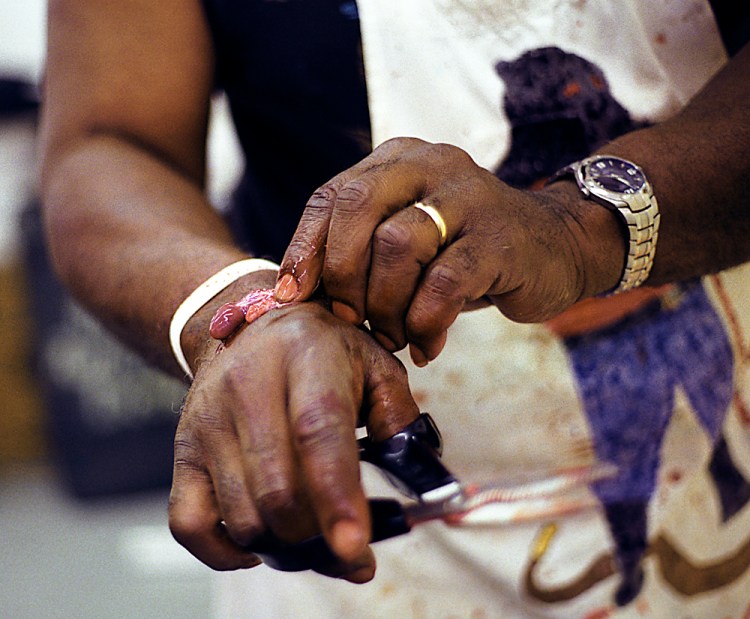 Robert Ray places a rattlesnake's still-beating heart on his hand after skinning the snake in front of a small audience on April April 26, 2008, in Mangum, Okla., during the 43rd Annual Mangum Rattlesnake Derby. Ray, a Mangum native who now resides in Oklahoma City, has been butchering rattlesnakes at the derby for 32 years.