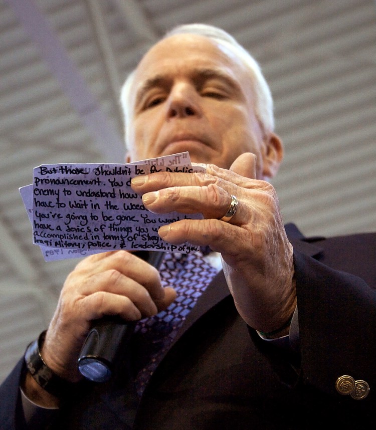 Sen. John McCain, R-Ariz., reads aloud a quote he always carries with him, on Feb. 1, 2008, in the Spirit of St. Louis Airport. The quote, by George Washington in 1789, reads, "The willingness with which our young people are likely to serve in any war, no matter how justified, shall be directly proportional to how they perceive the veterans of earlier wars and how they were treated and appreciated by their nation."