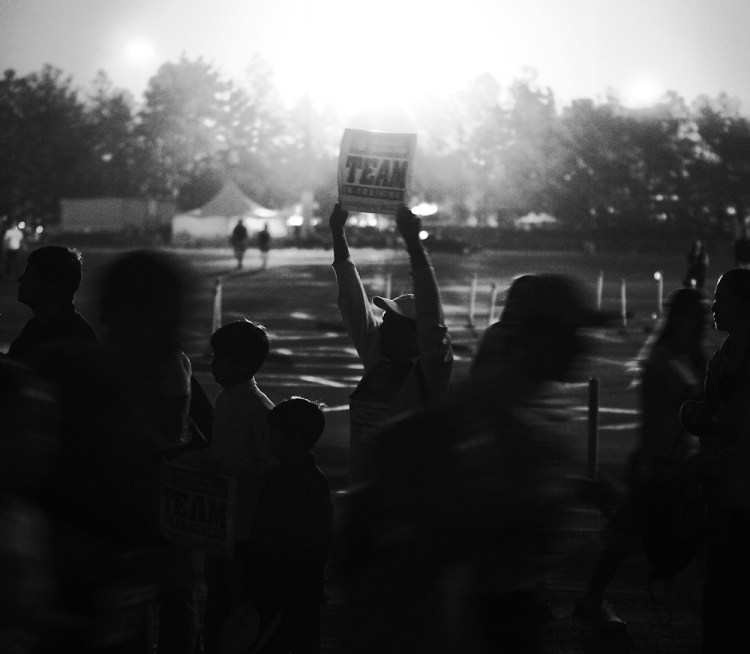 A man holds up a sign to cheer on participants in the Disney World Marathon near Mile 2 on Jan. 13, 2008. The marathon course began and ended in Epcot, and went through each of the theme parks in the Disney World complex.