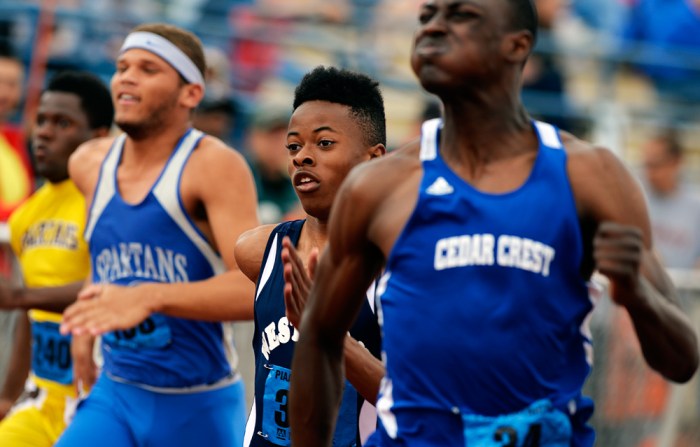 West York's Abdul Junaid runs the 100-meter dash trial on the first day of the District 3 track and field championships on Friday, May 16, 2014, at Shippensburg University. Chris Dunn — Daily Record/Sunday News